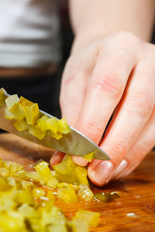 Woman Slicing Pickles