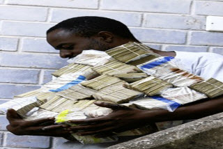 Buying Groceries In Zimbabwe, Source AP Buying Groceries In Zimbabwe, Source Associated Press