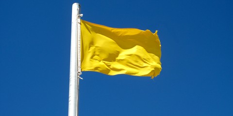 https://www.dreamstime.com/stock-images-attention-yellow-flag-image27082574